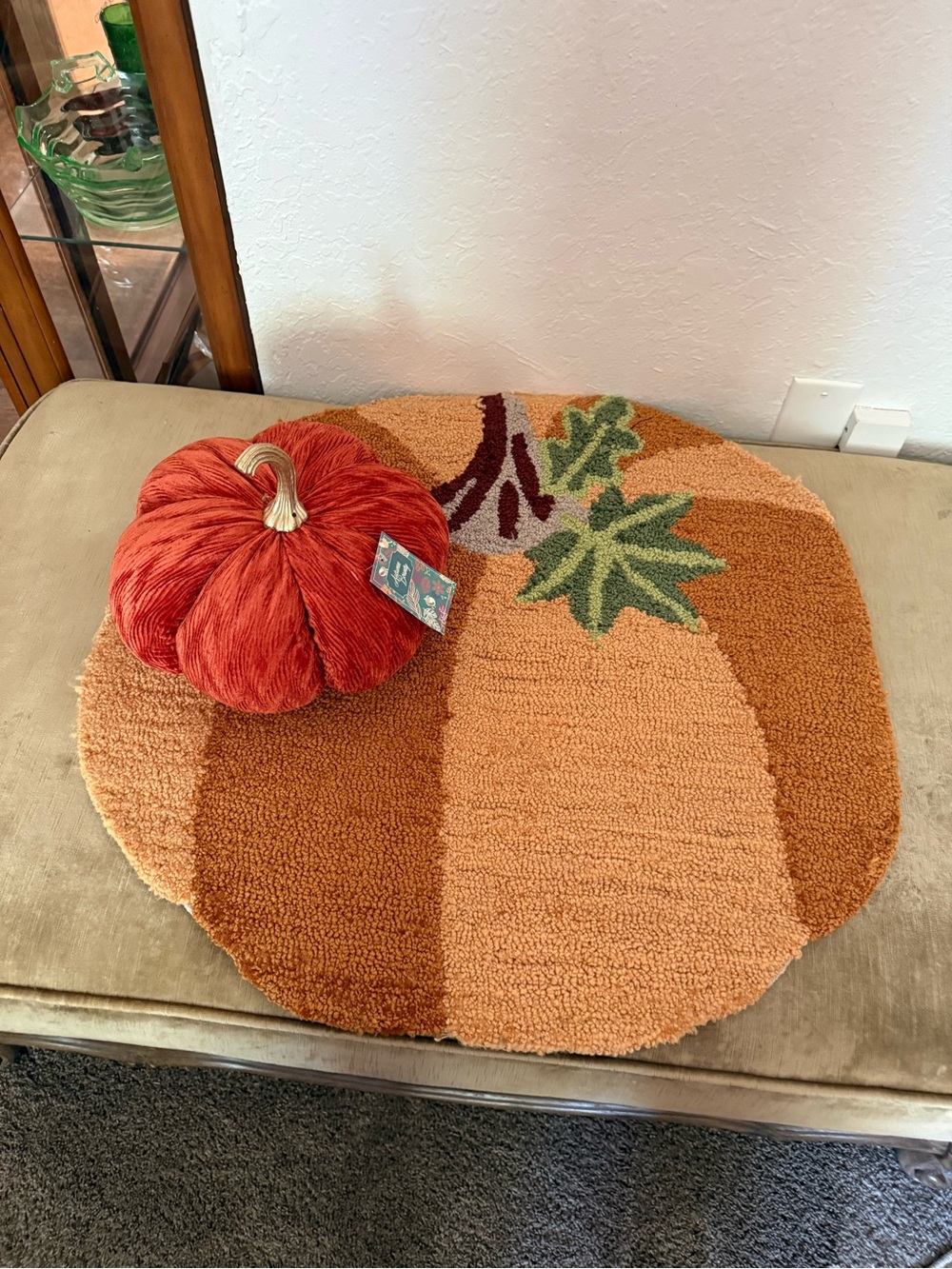 Autumn Pumpkin Accent thick and plush hooked Rug , and an orange cloth pumpkin.